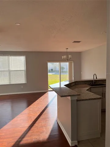 a kitchen with a sink and a large window