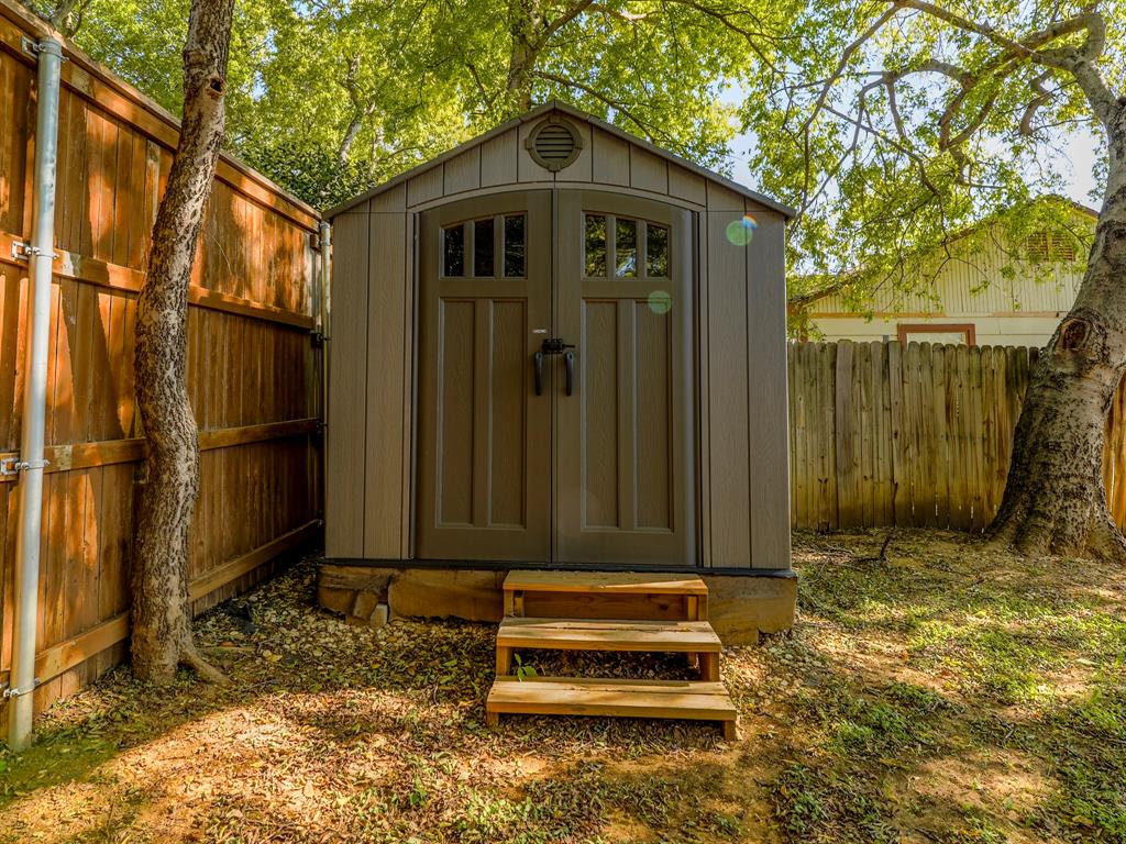 422 Washington Street Grapevine, TX 76051 - Photo 13 of 16 a wooden door in front of a house