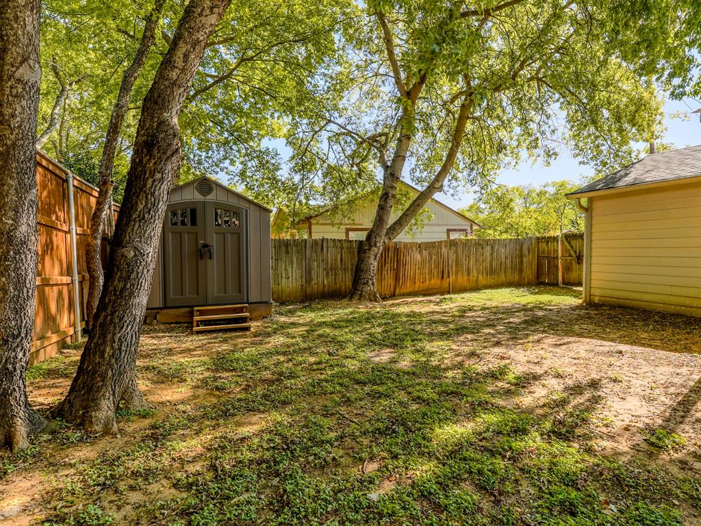 422 Washington Street Grapevine, TX 76051 - Photo 14 of 16 a house view with a backyard space