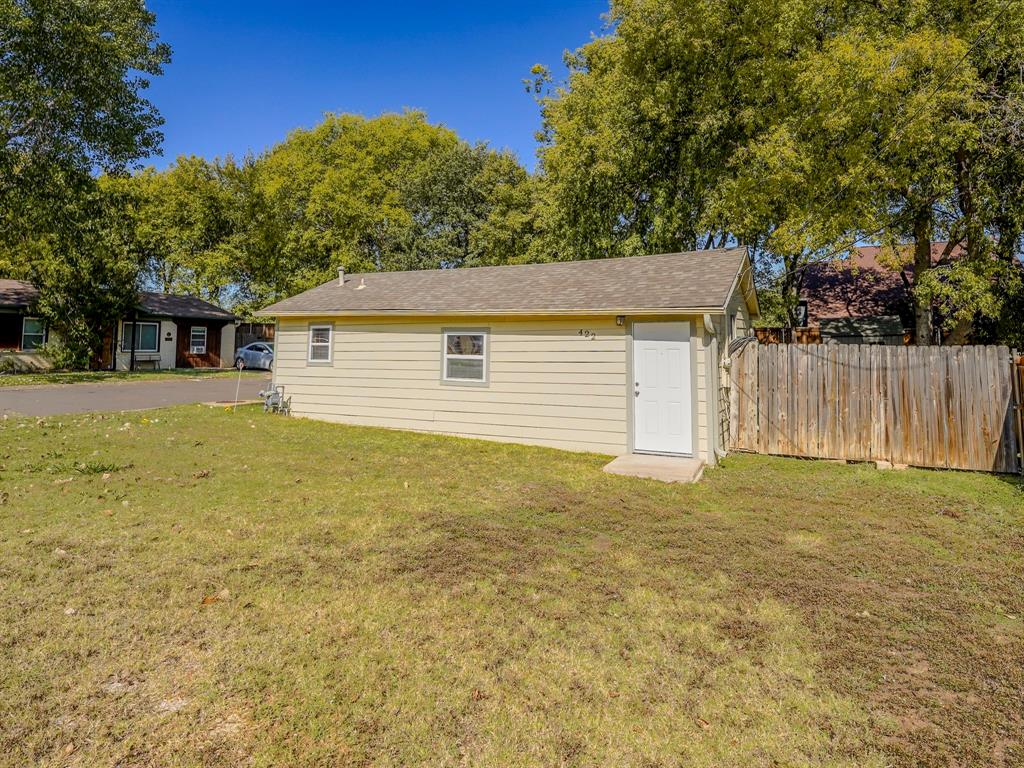 422 Washington Street Grapevine, TX 76051 - Photo 16 of 16 a front view of house with yard and trees in the background