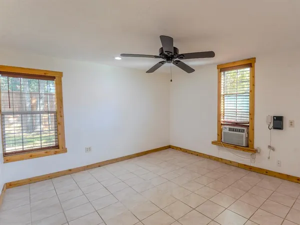 a view of an empty room and window