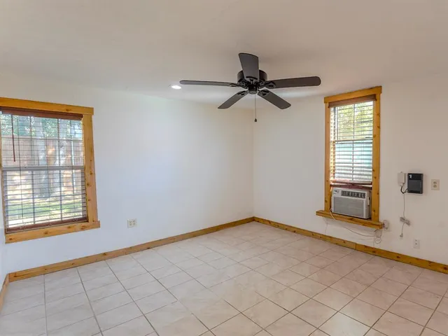 a view of an empty room and window
