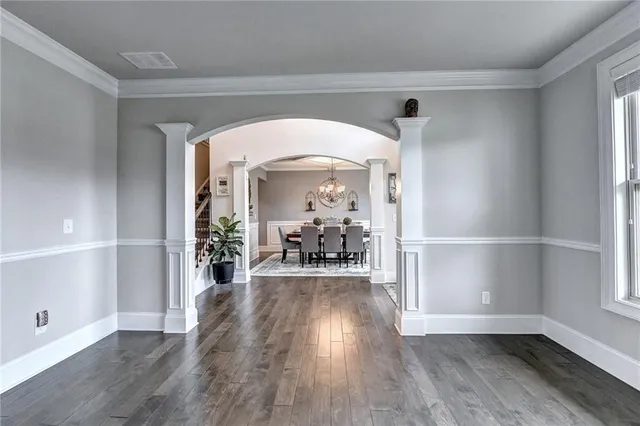 a living room with furniture fireplace and a large window