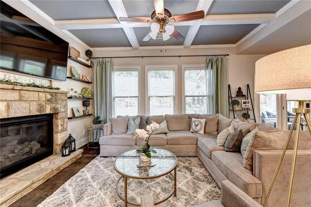 a living room with kitchen island furniture and a large window