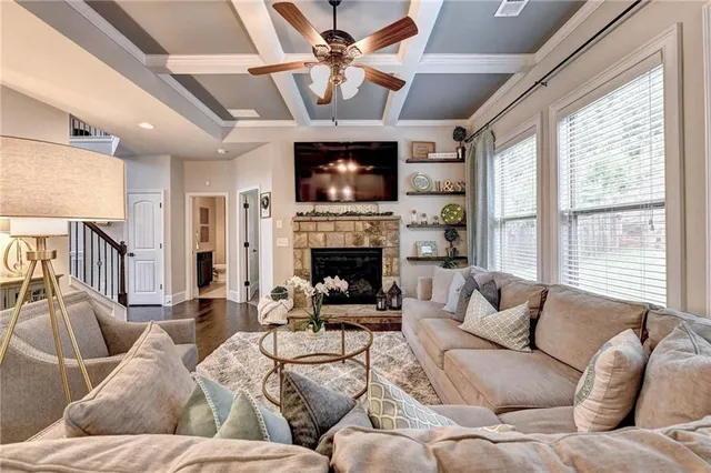 a kitchen with stainless steel appliances granite countertop a stove top oven a refrigerator a sink and dishwasher