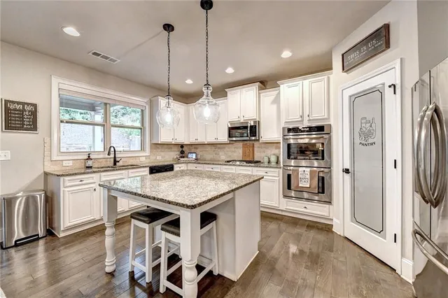 a large bedroom with a large bed and a window