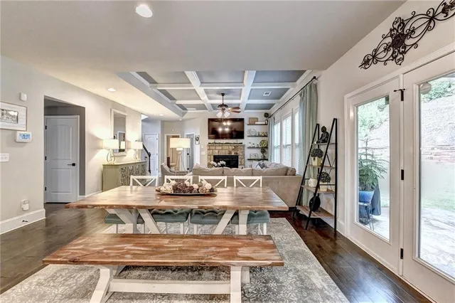 a living room with furniture ceiling fan and a window