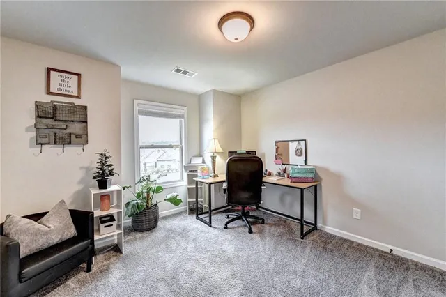 a bedroom with a bed and a large mirror