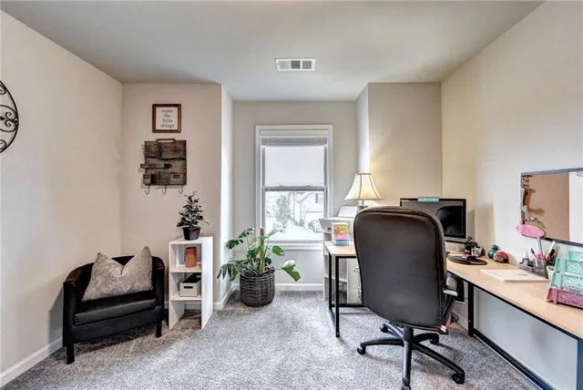 a bedroom with bed and a chandelier
