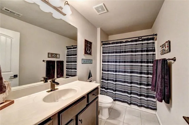an aerial view of a house with swimming pool patio and outdoor seating
