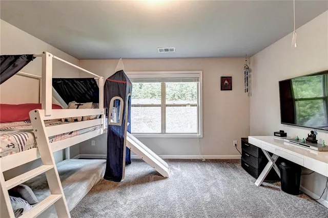 a view of a house with backyard sitting area and garden