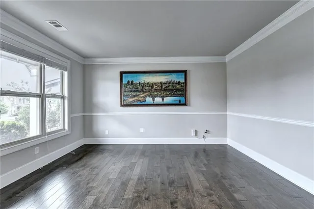 a bedroom with a bed and a lamp