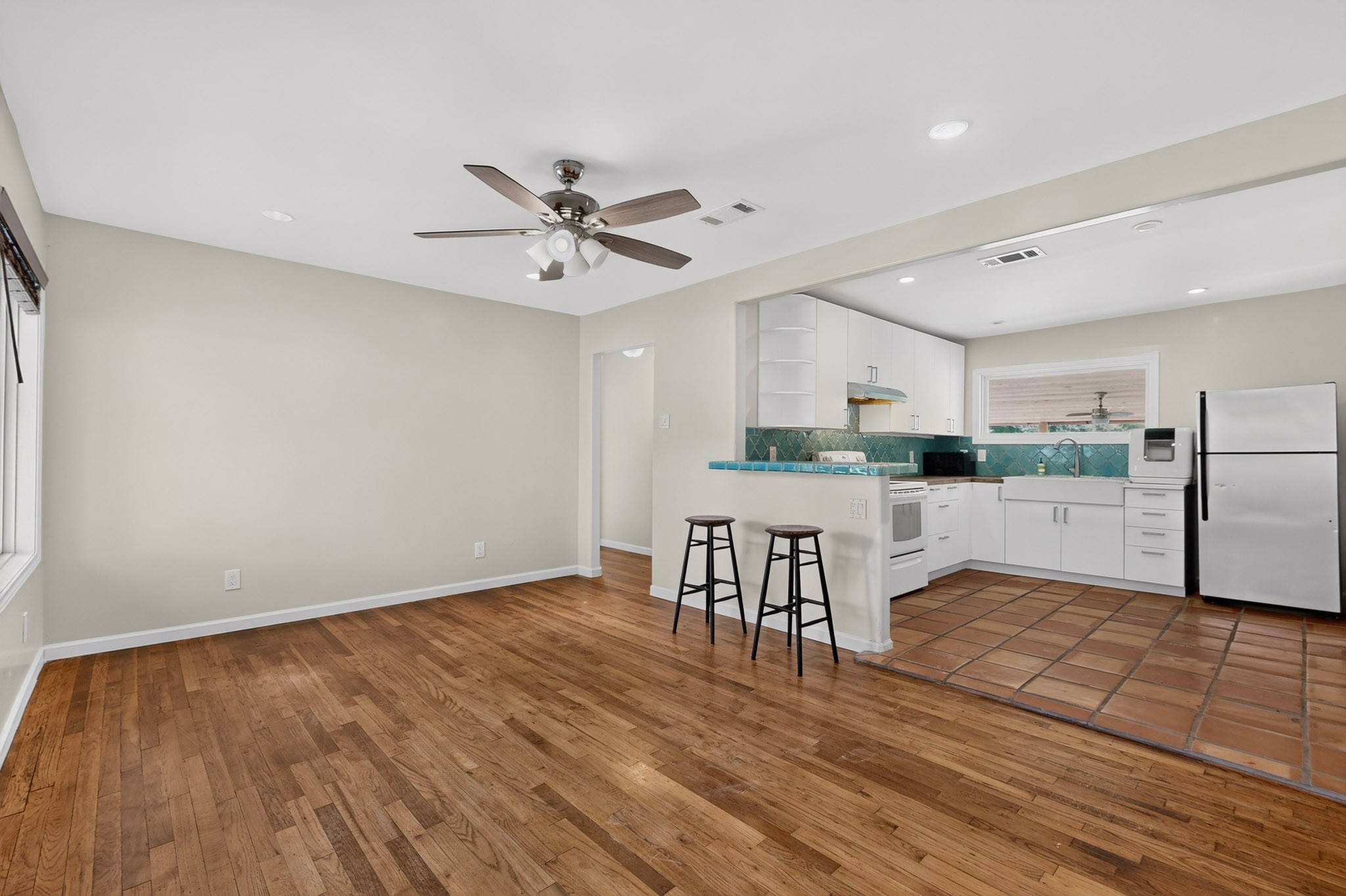 4711 Alf Avenue Austin, TX 78721 - Photo 7 of 34 An open concept living area transitions to the remodeled kitchen