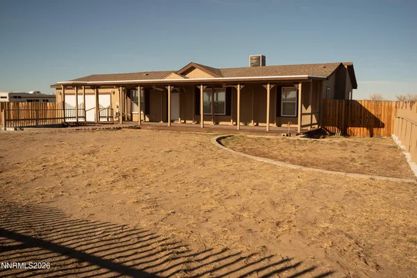 a front view of a house with basket ball court