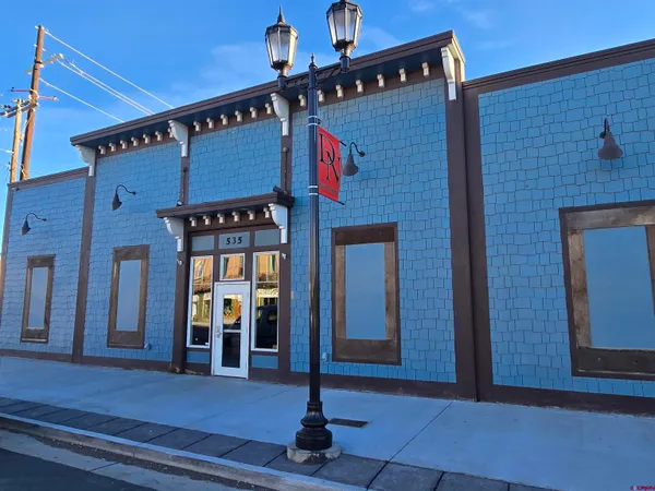 a front view of a building with glass door and door
