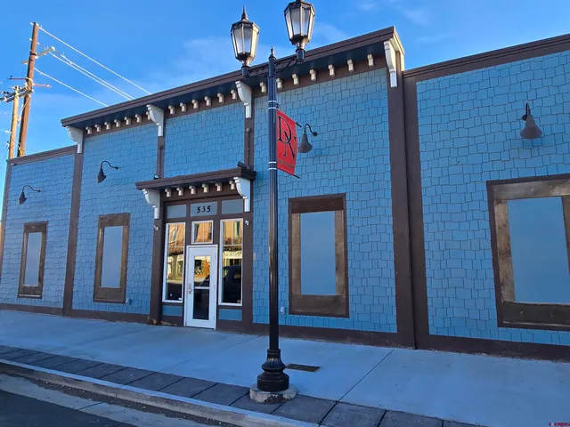a front view of a building with glass door and door