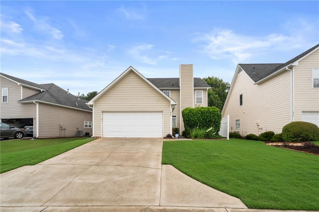 878 Scales Road Suwanee, GA 30024 - Photo 17 of 17 a view of a house with a yard