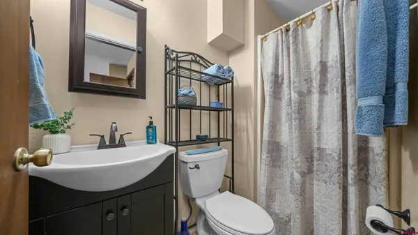 a view of a backyard with a garden and fire pit