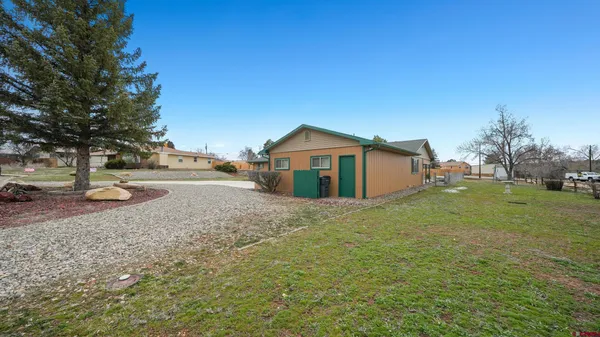 a view of a backyard with sitting area