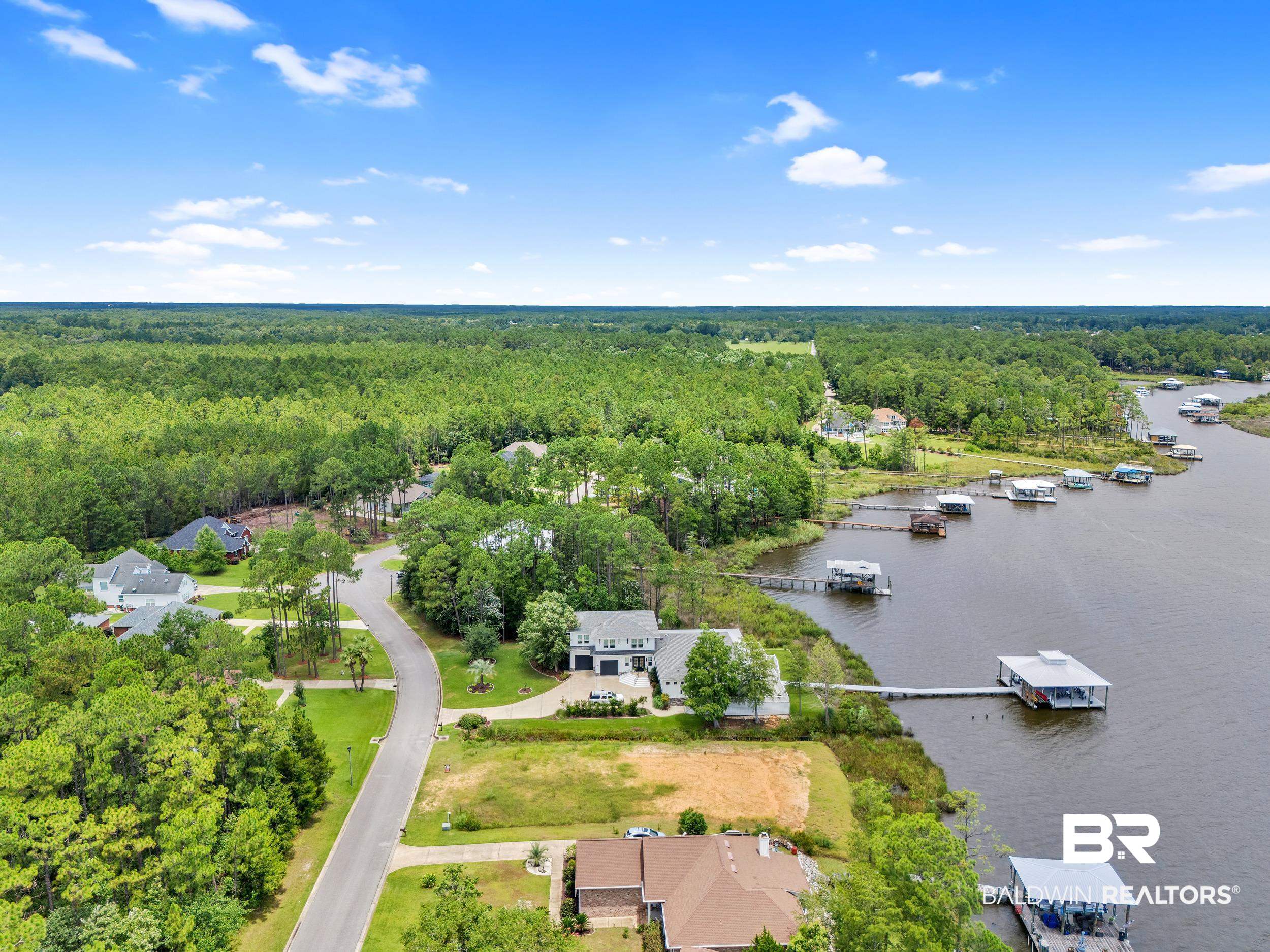8963 Bay Point Drive Elberta, AL 36530 - Photo 16 of 25 Bird's eye view of a forest and a large body of water