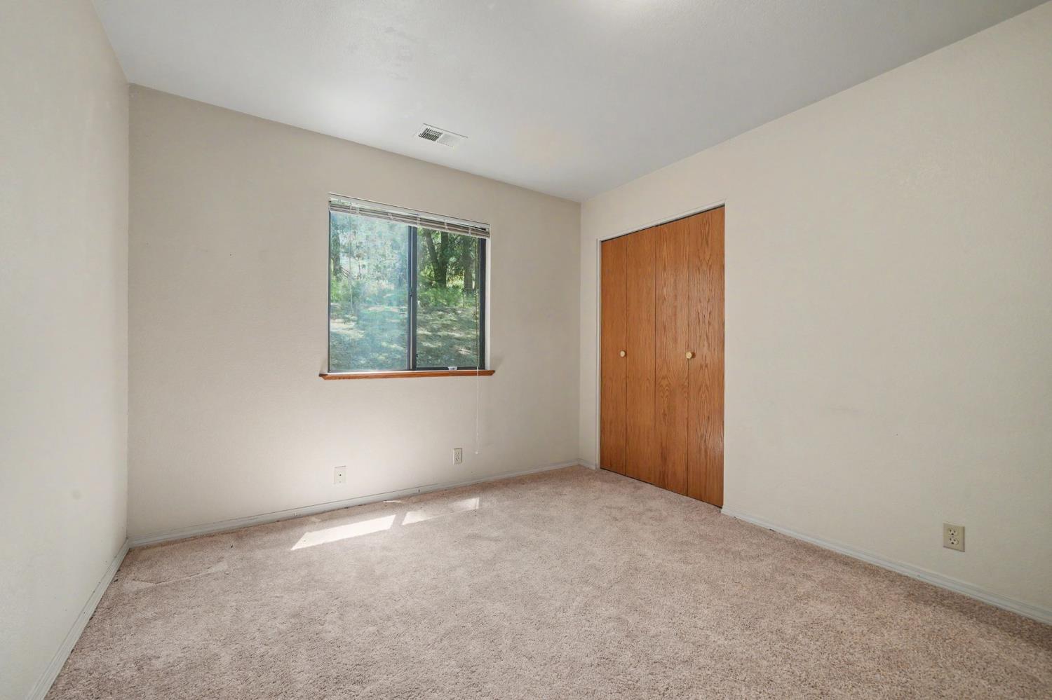 20310 State Rte 26 West Point, CA 95255 - Photo 34 of 57 an empty room with windows and closet