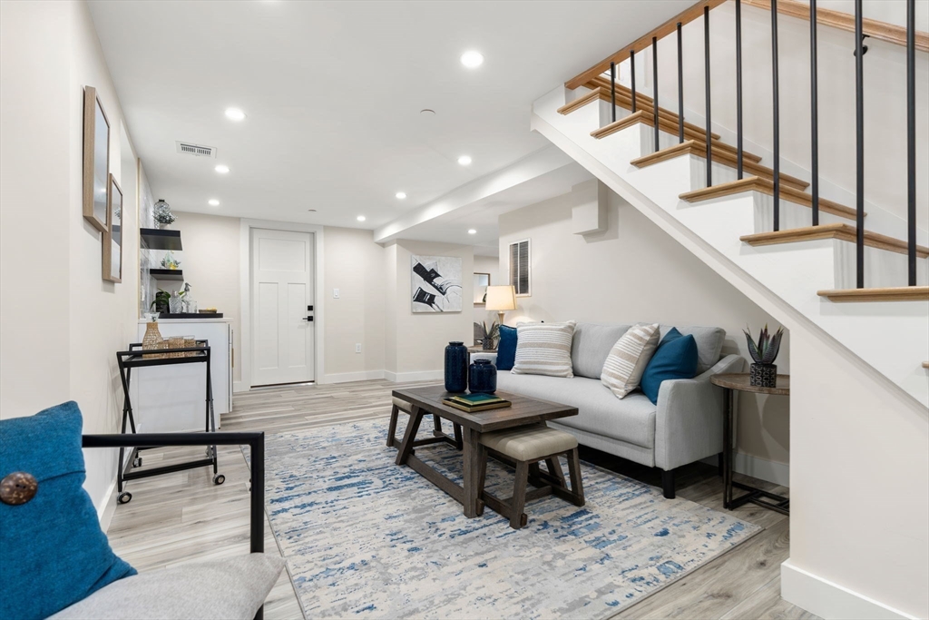 10 Marion Road, Unit 1 Belmont, MA 02478 - Photo 15 of 26 a living room with furniture and a wooden floor