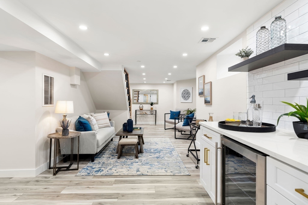 10 Marion Road, Unit 1 Belmont, MA 02478 - Photo 16 of 26 a living room with furniture and wooden floor