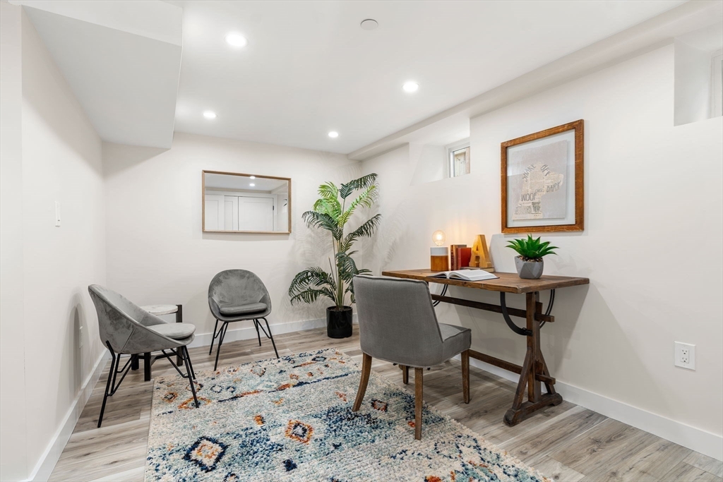 10 Marion Road, Unit 1 Belmont, MA 02478 - Photo 18 of 26 a view of a workspace and dining room