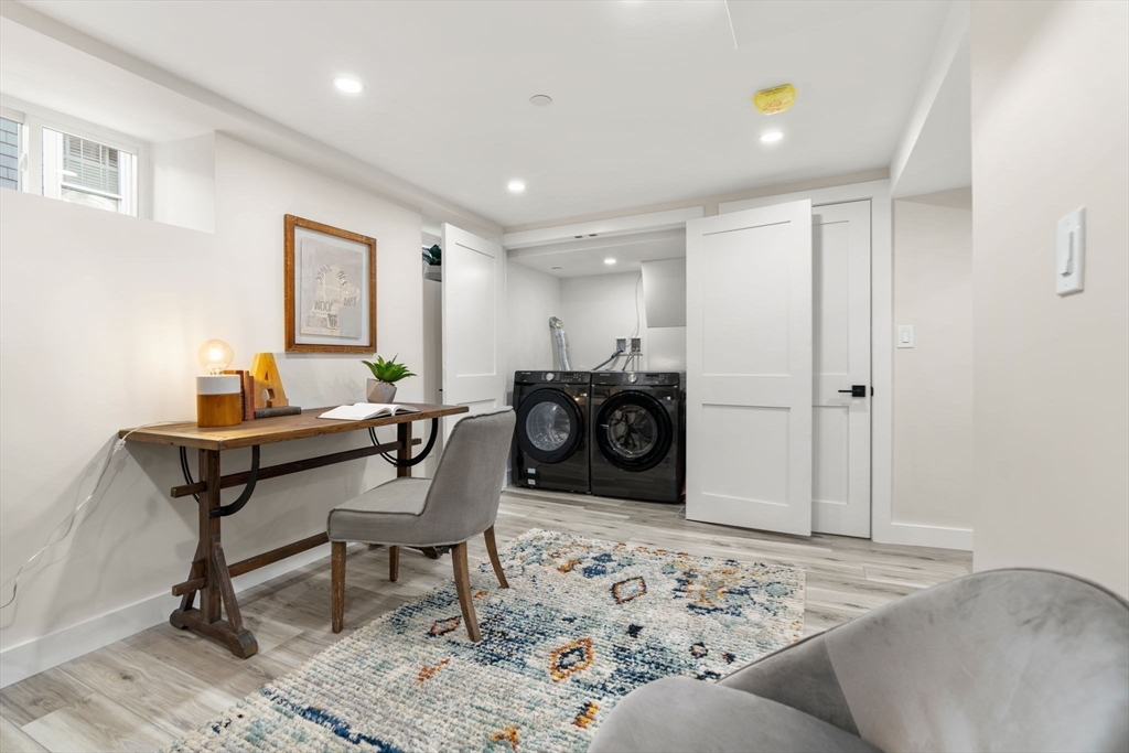 10 Marion Road, Unit 1 Belmont, MA 02478 - Photo 19 of 26 a living room with furniture a rug and a dresser