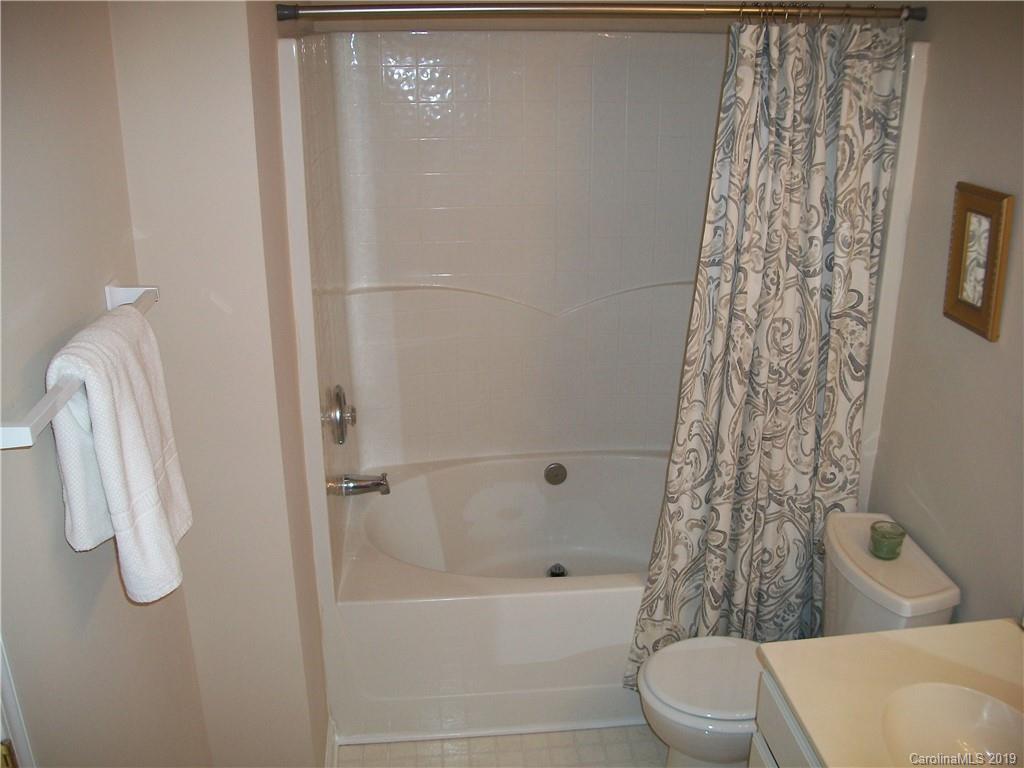 6646 Rothchild Drive Charlotte, NC 28270 - Photo 14 of 23 a bathroom with a shower curtain