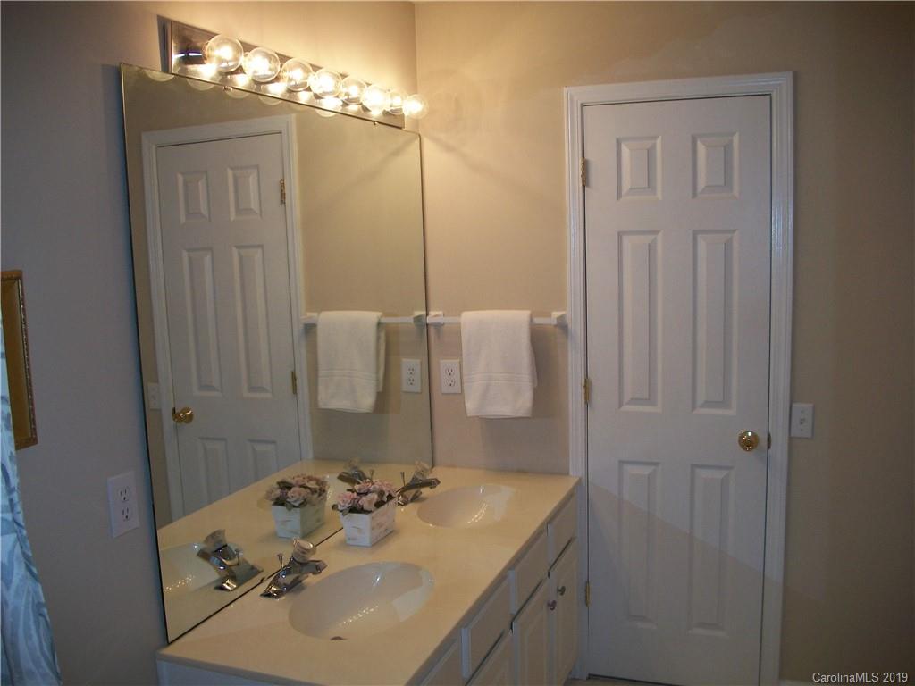 6646 Rothchild Drive Charlotte, NC 28270 - Photo 15 of 23 a bathroom with a sink and a mirror