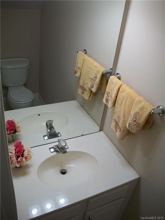 6646 Rothchild Drive Charlotte, NC 28270 - Photo 8 of 23 a bathroom with a sink and a toilet