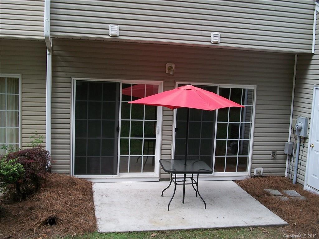 6646 Rothchild Drive Charlotte, NC 28270 - Photo 10 of 23 a front view of a house with a yard and outdoor seating