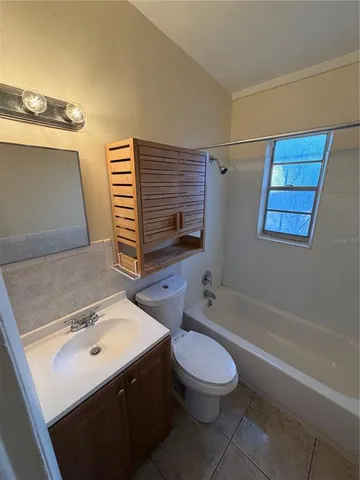 a view of a yard with large trees