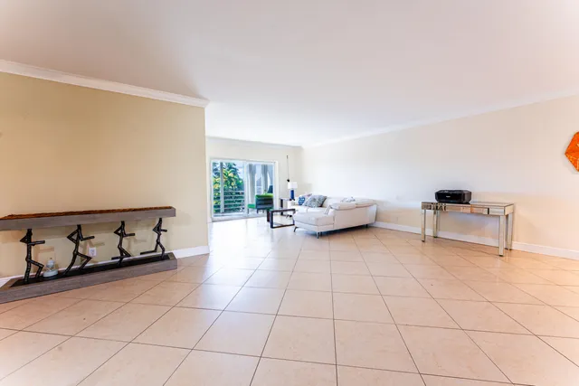 a living room with furniture and white walls