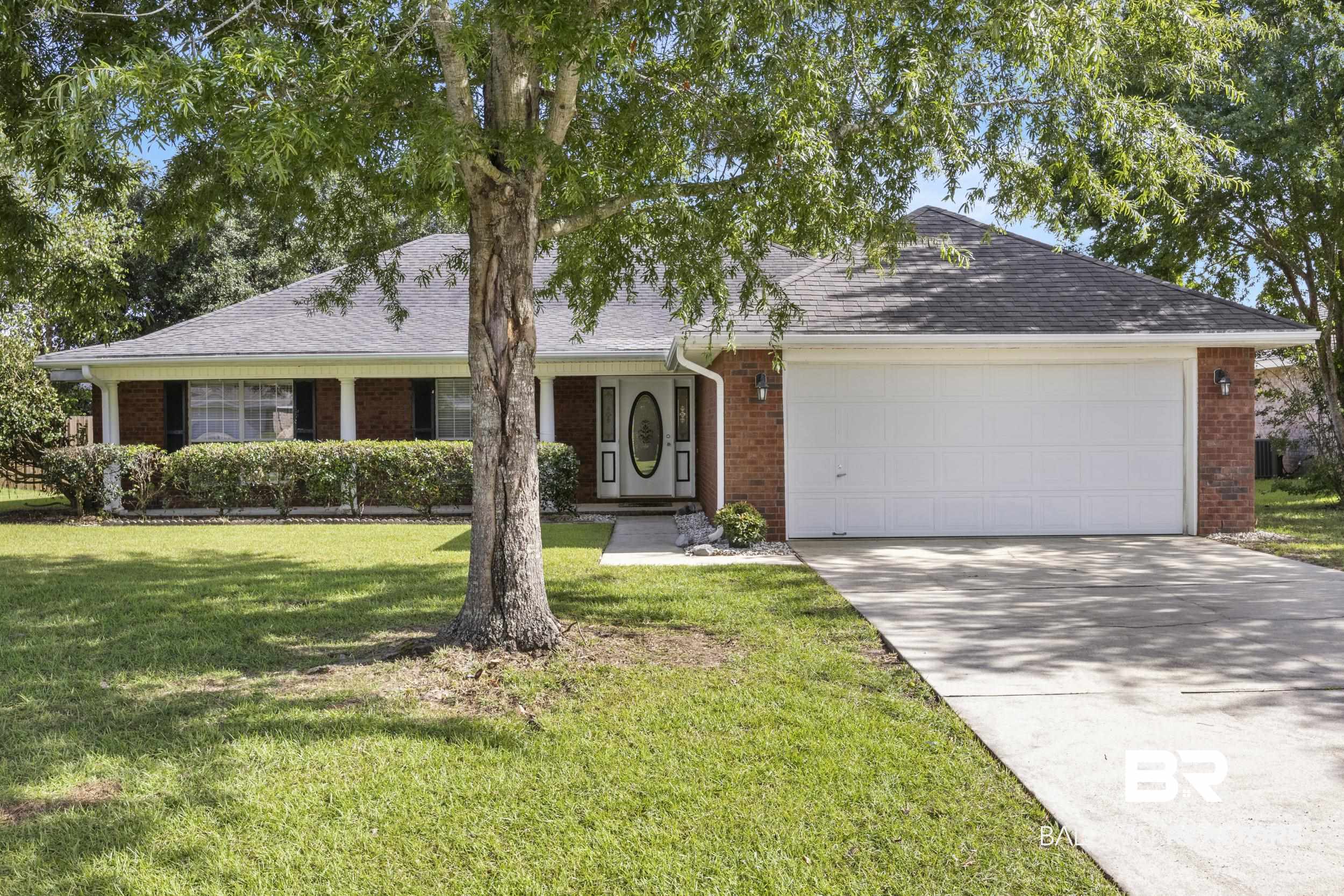 9610 Watkins Drive Fairhope, AL 36532 - Photo 15 of 26 Ranch-style house featuring a garage and a front lawn