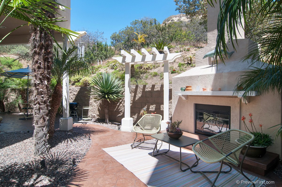 2747 MacKinnon Ranch Road Cardiff, CA 92007 - Photo 18 of 23 Private Backyard with Fireplace
