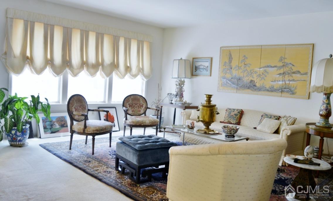 171 Concordia Circle, Unit C Monroe Township, NJ 08831 - Photo 2 of 13 a living room with furniture and a large window