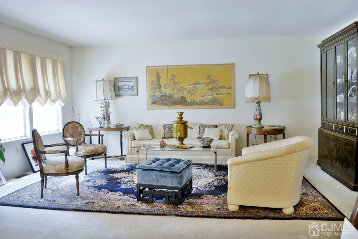 171 Concordia Circle, Unit C Monroe Township, NJ 08831 - Photo 4 of 13 a living room with furniture and a large window