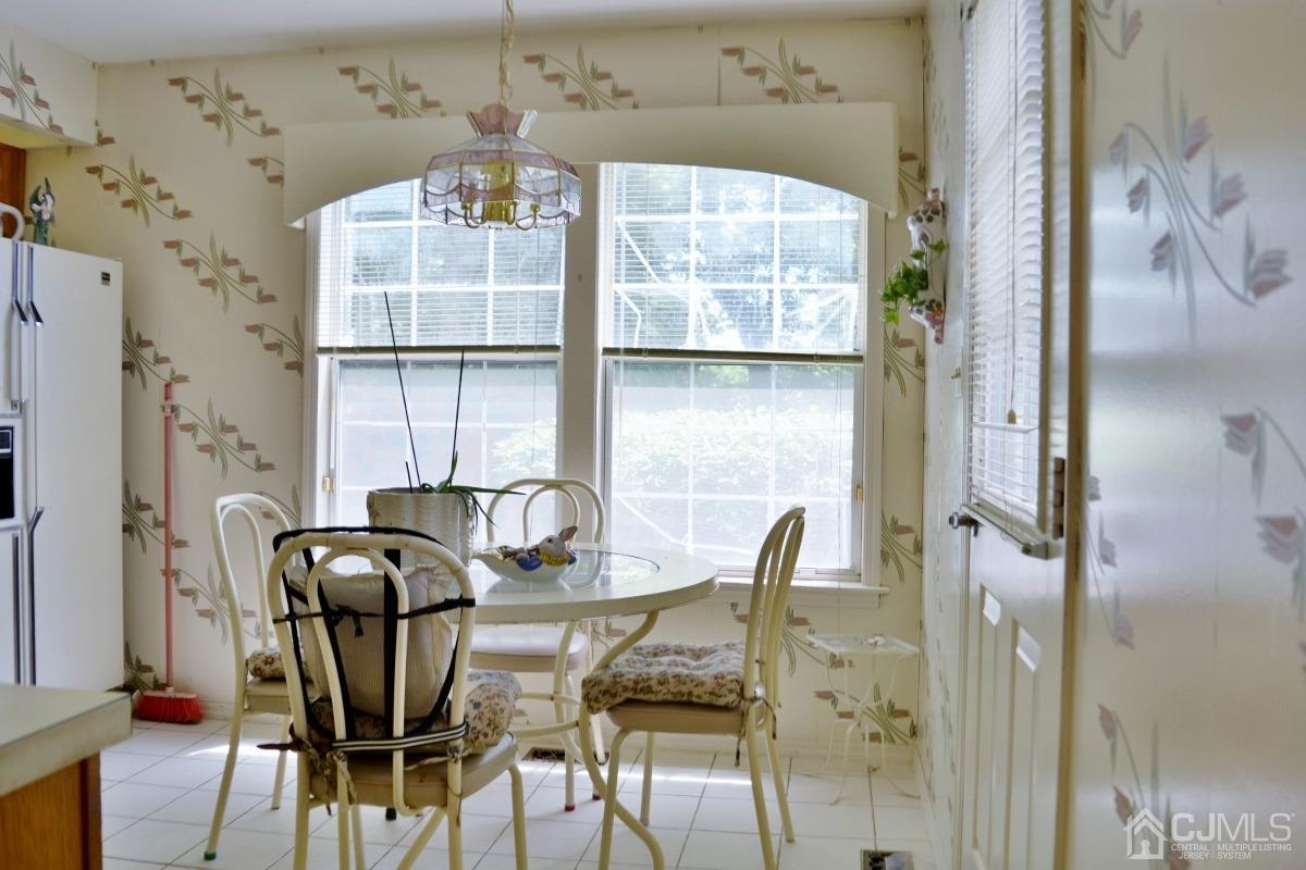 171 Concordia Circle, Unit C Monroe Township, NJ 08831 - Photo 6 of 13 a view of a dining room with furniture and a window