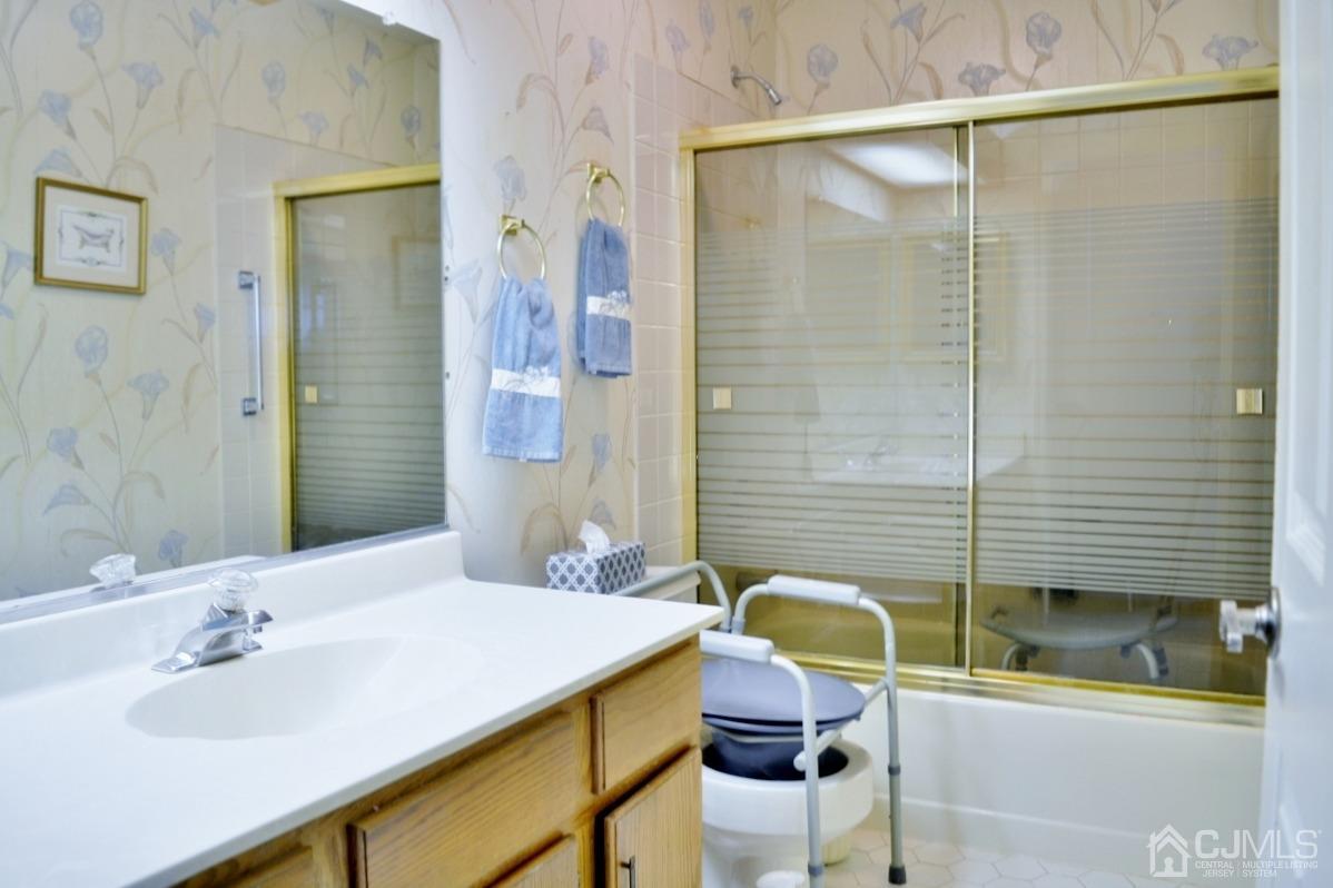 171 Concordia Circle, Unit C Monroe Township, NJ 08831 - Photo 10 of 13 a bathroom with a sink and a mirror