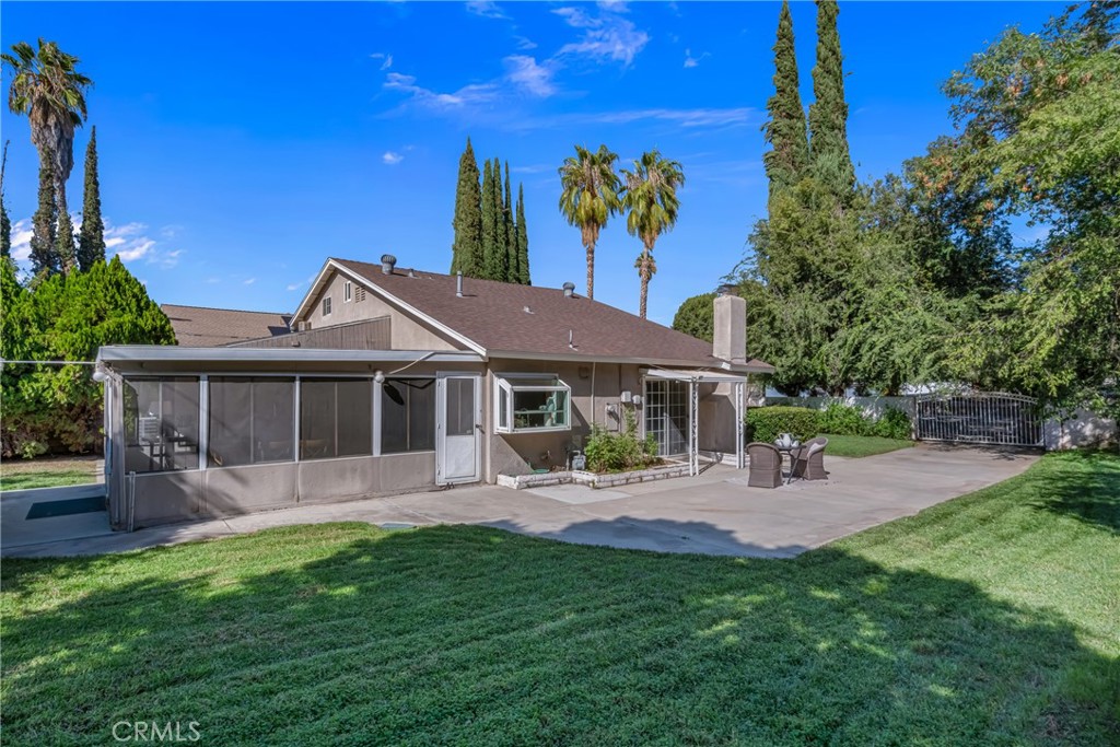 5165 Pearblossom Drive Riverside, CA 92507 - Photo 16 of 75 a front view of a house with a yard and potted plants