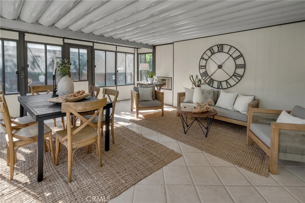 5165 Pearblossom Drive Riverside, CA 92507 - Photo 28 of 75 a living room with furniture a table and a large window