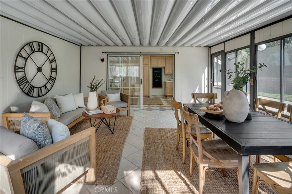 5165 Pearblossom Drive Riverside, CA 92507 - Photo 31 of 75 a living room with furniture a window and wooden floor
