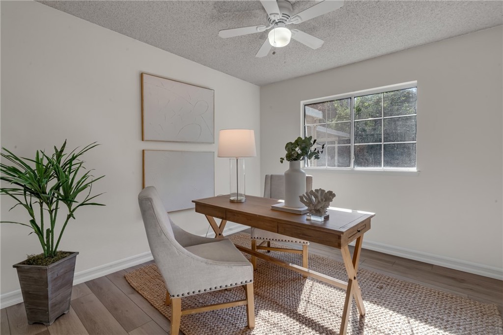5165 Pearblossom Drive Riverside, CA 92507 - Photo 33 of 75 a view of a workspace with furniture and a potted plant