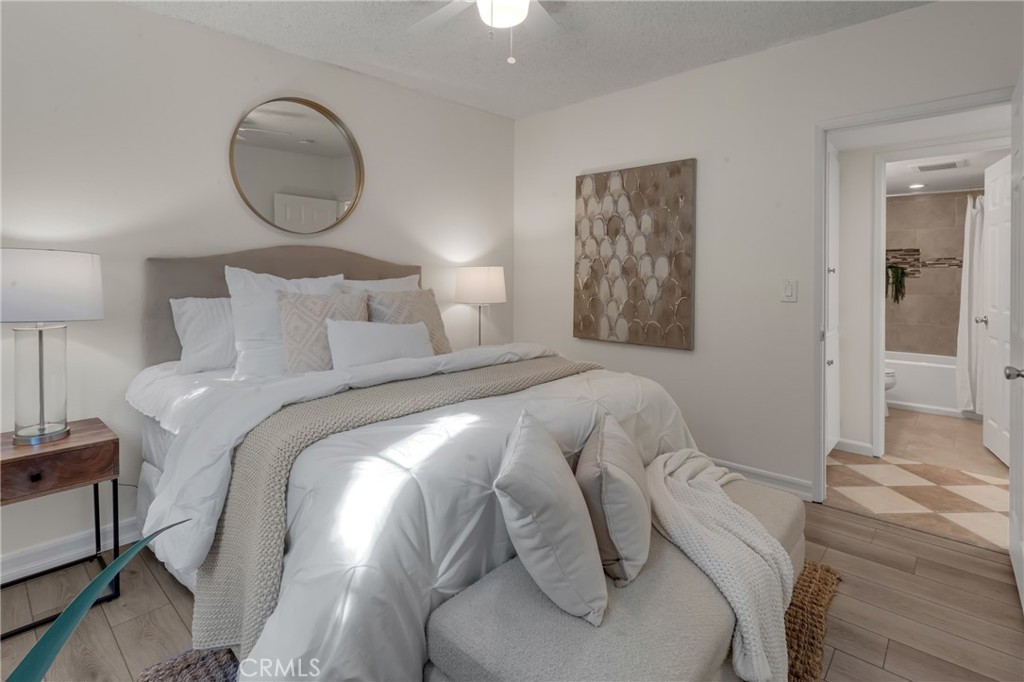 5165 Pearblossom Drive Riverside, CA 92507 - Photo 37 of 75 a bed room with a bed and a lamp