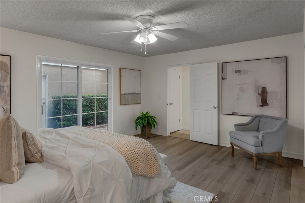 5165 Pearblossom Drive Riverside, CA 92507 - Photo 44 of 75 a bed room with a bed and a chair