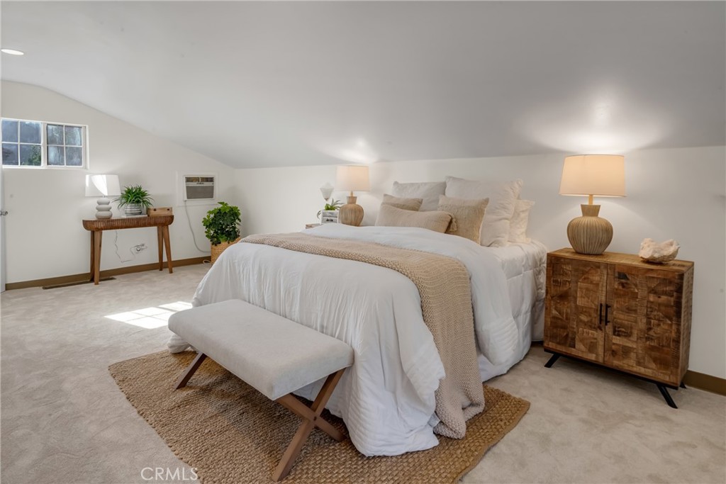 5165 Pearblossom Drive Riverside, CA 92507 - Photo 51 of 75 a spacious bedroom with a bed and a dresser in it