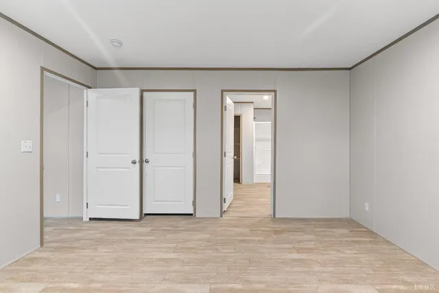a bathroom with a double vanity sink toilet and a mirror