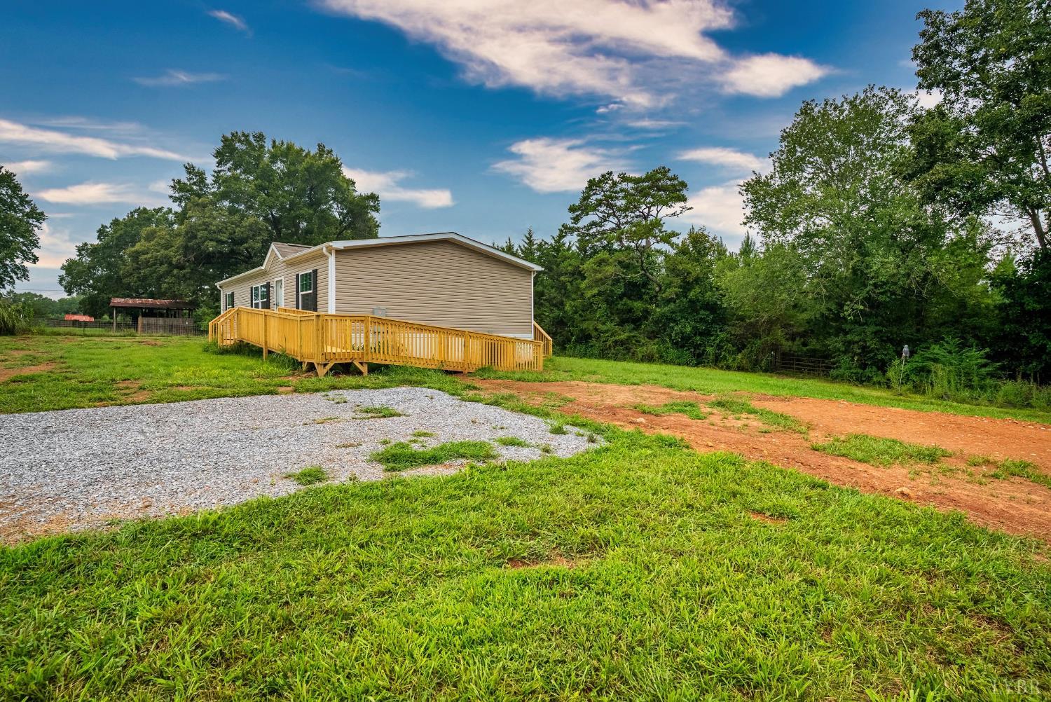 4526 Pigeon Run Road Gladys, VA 24554 - Photo 29 of 54 a view of a backyard with large trees